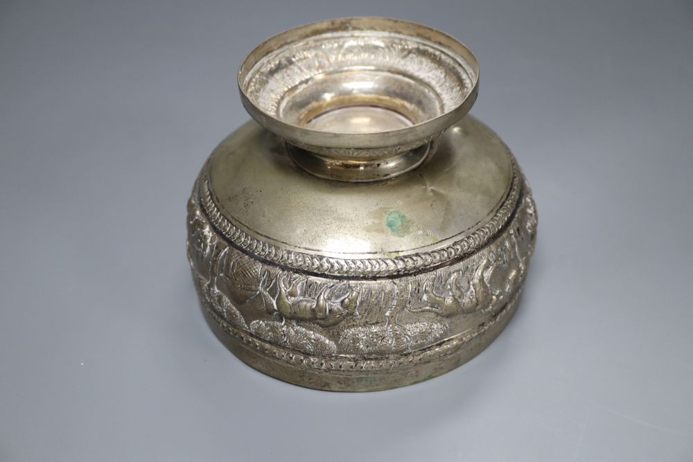 An Edwardian silver christening mug, a Victorian silver foliate sifter spoon, Indian? bowl, Chinese napkin ring & a snuff box.